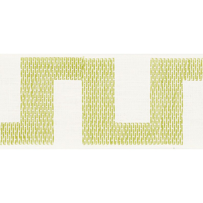 May include: White fabric with a green geometric pattern. The pattern is made up of vertical lines that form a series of squares.