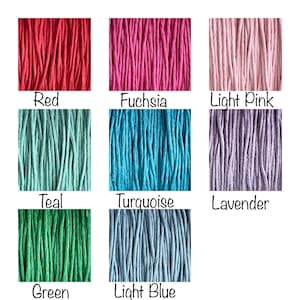 May include: A collection of 10 different colors of cotton cord, including red, fuchsia, light pink, teal, turquoise, lavender, green, and light blue. The cords are arranged in a grid pattern.