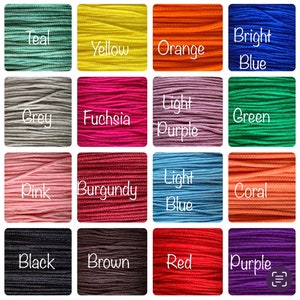 May include: A color chart of 16 different colors of embroidery floss. The colors are teal, yellow, orange, bright blue, grey, fuchsia, light purple, green, pink, burgundy, light blue, coral, black, brown, red, and purple.