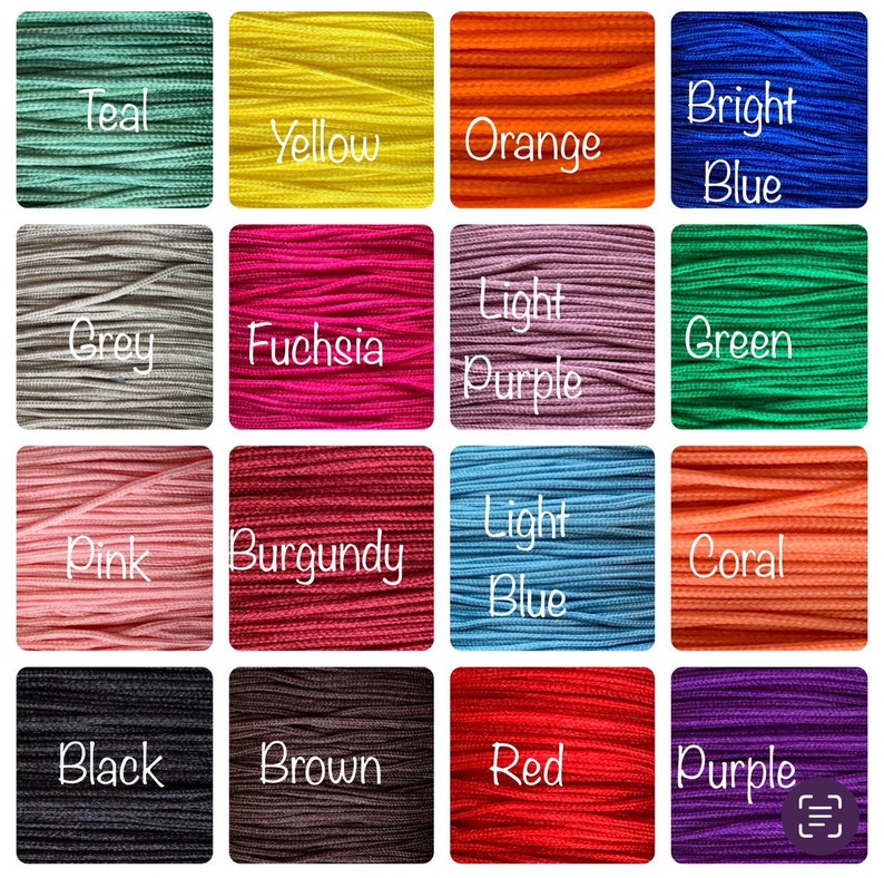May include: A color chart of 16 different colors of embroidery floss. The colors are teal, yellow, orange, bright blue, grey, fuchsia, light purple, green, pink, burgundy, light blue, coral, black, brown, red, and purple.
