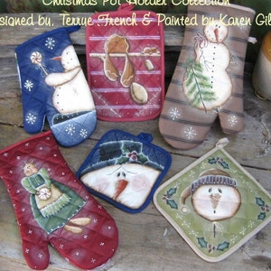 May include: A collection of six Christmas pot holders featuring snowman and gingerbread designs. The pot holders are quilted and have a variety of colors, including red, green, blue, and brown. The pot holders are designed by Terrie French and painted by Karen Gilbert.