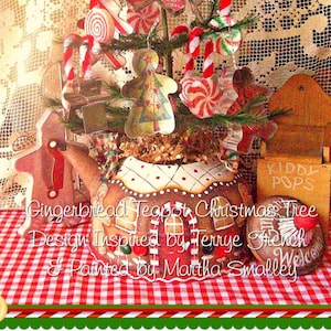 May include: A gingerbread teapot Christmas tree decorated with candy canes, gingerbread men, and other festive ornaments. The teapot is painted with a gingerbread house design and the text "Gingerbread Teapot Christmas Tree, Design Inspired by Terrye French & Painted by Martha Smalley".