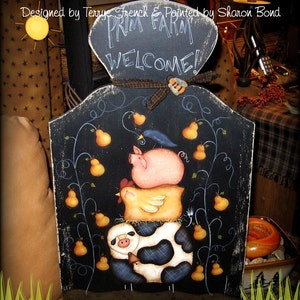 May include: A black chalkboard sign with the words "Prim Pear Farm" and "Welcome!" painted in white. The sign features a whimsical painted scene of a cow, a chicken, a pig, and pears on a vine.