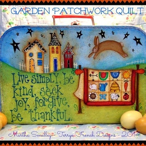 May include: A vintage suitcase painted with a whimsical scene of houses, a bunny rabbit, and a patchwork quilt. The suitcase has a blue background with white stars and the text "Live simply, be kind, seek joy, forgive, be thankful."  The text "Martha Smalley - Terrye French Designs - 2014" is also painted on the suitcase.