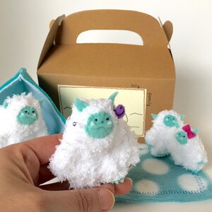 Little Yety family, hand knitted toy and ornament.