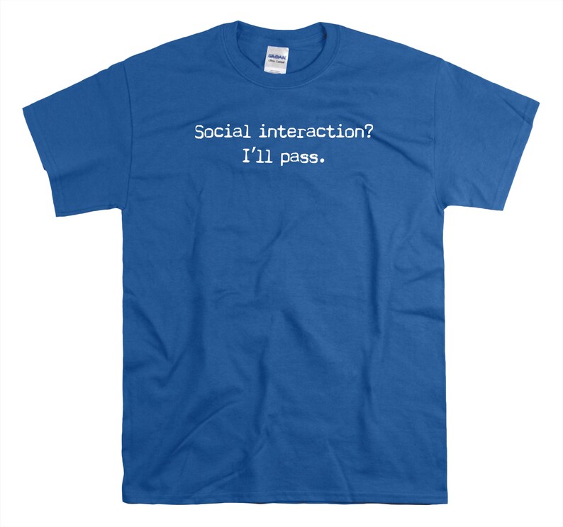 May include: A royal blue t-shirt with the text "Social interaction? I'll pass." printed in white.