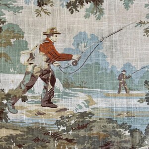 May include: A vintage fabric featuring a scene of two people fishing in a river. The fabric has a light beige background with green and blue foliage and a light blue river. One person is wearing a red shirt and a hat, while the other person is wearing a brown shirt and a hat. Both people are holding fishing rods.