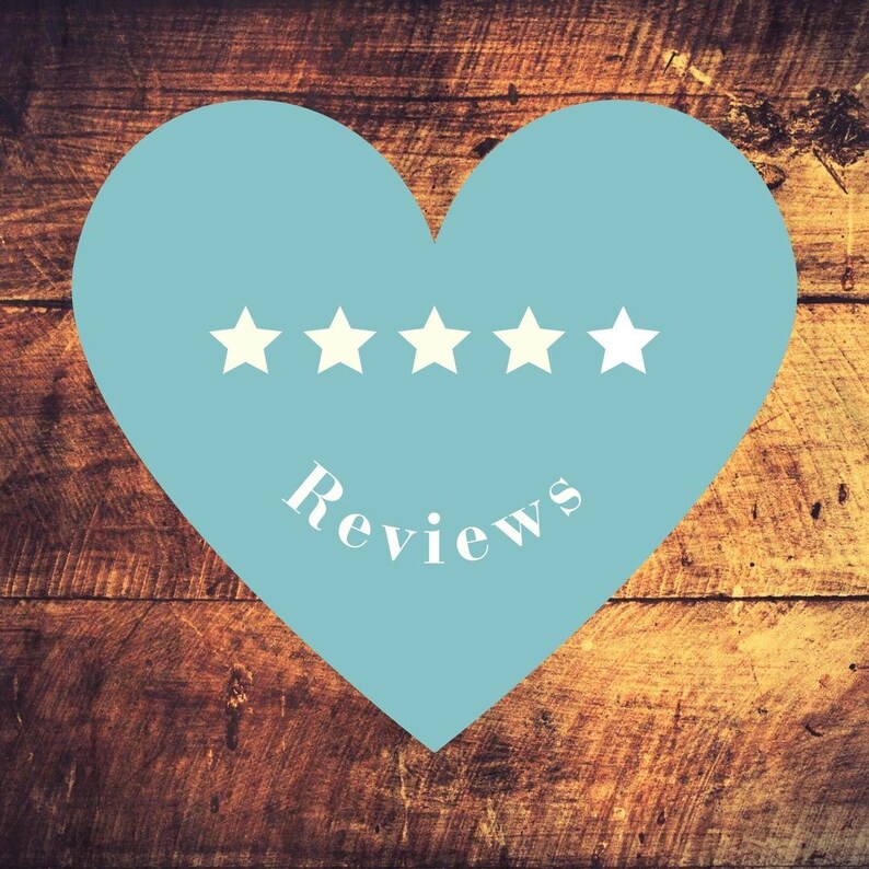 May include: A light blue heart shape with five white stars and the word "Reviews" in white script. The heart is set against a rustic, wooden background.