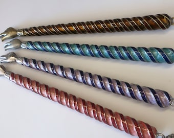 Torah pointer in 4 colors: a Purple Twist is pictured, Swirl Yad in purple