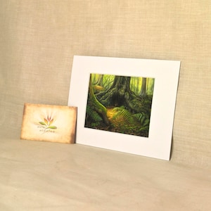 May include: A framed print of a painting depicting a lush green forest with a large tree trunk in the center. The tree trunk is covered in moss and vines, and the forest floor is covered in ferns and other foliage.