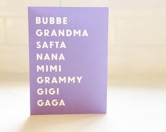 May include: A purple card with the words "Bubbe, Grandma, Safta, Nana, Mimi, Grammy, Gigi, Gaga" printed in white.