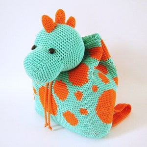 Crochet pattern for dino backpack. Cute and practical accessory for kids. Charts with symbols, written instructions, photo tutorial.