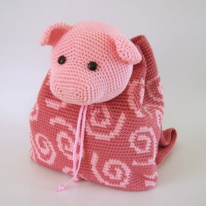 Crochet pattern for pig backpack. Cute and practical accessory for kids. Charts with symbols, written instructions, photo tutorial.