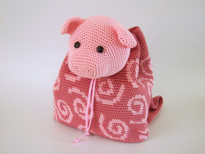 Crochet pattern for pig backpack. Cute and practical accessory for kids. Charts with symbols, written instructions, photo tutorial. image 1