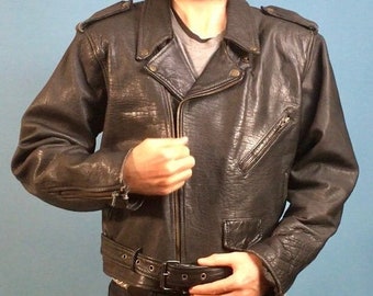 May include: A black leather biker jacket with a zip fastening and a belt at the waist.