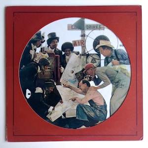 May include: A vintage record album cover featuring a group of people gathered around a map, with a red border and the word "side" in the upper right corner.