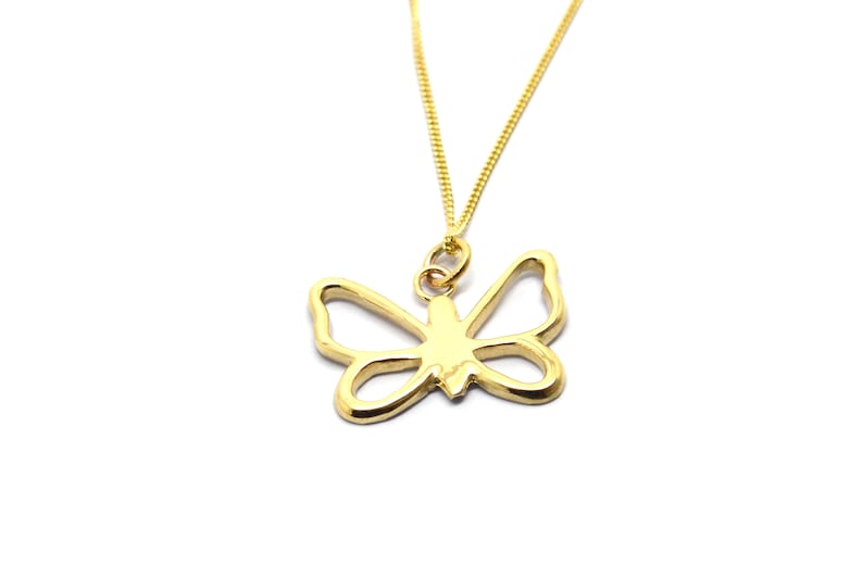 May include: A gold chain necklace with a delicate butterfly pendant. The butterfly is a simple outline design.