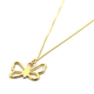 May include: A gold chain necklace with a delicate butterfly pendant. The butterfly is a simple outline with no details.