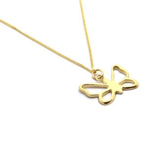 May include: A gold chain necklace with a delicate butterfly pendant. The butterfly is a simple outline design.
