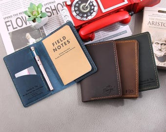 May include: Four leather notebook covers in different colors, blue, brown, dark brown, and black. Each cover has a different inscription, "Family & Tim We Meet You There From Home", "I love you", "FID", and "Families & Tim We Meet You There From Home".