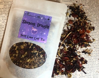May include: A white paper bag with a purple and white label that reads "Becca's Little Teas Sleeping Draught Decaf Loose Leaf Tea". The bag contains a loose leaf tea blend. The tea is a mix of dried herbs and flowers, including red and orange pieces.