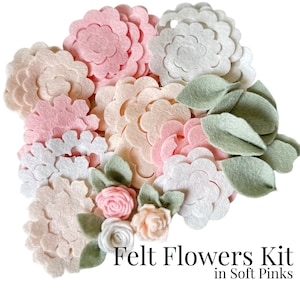 May include: A felt flower craft kit with a variety of pink, white, and cream felt flowers and leaves. The kit includes the text "Felt Flowers Kit in Soft Pinks".