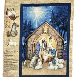 May include: A fabric panel depicting a nativity scene within a blue border. The central image shows Mary, Joseph, and baby Jesus in a stable, surrounded by animals. The background is a starry night with a bright light.