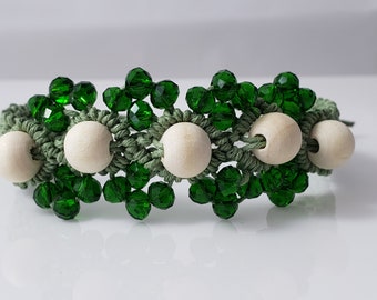 Adjustable length macrame bracelet, white wood beads surrounded by green glass bicone beads, made from green hemp cord