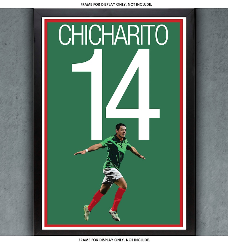 May include: A framed poster featuring the name "CHICHARITO" above the number "14" in white. The poster has a green background with a soccer player in a green jersey and red socks. The frame is black.