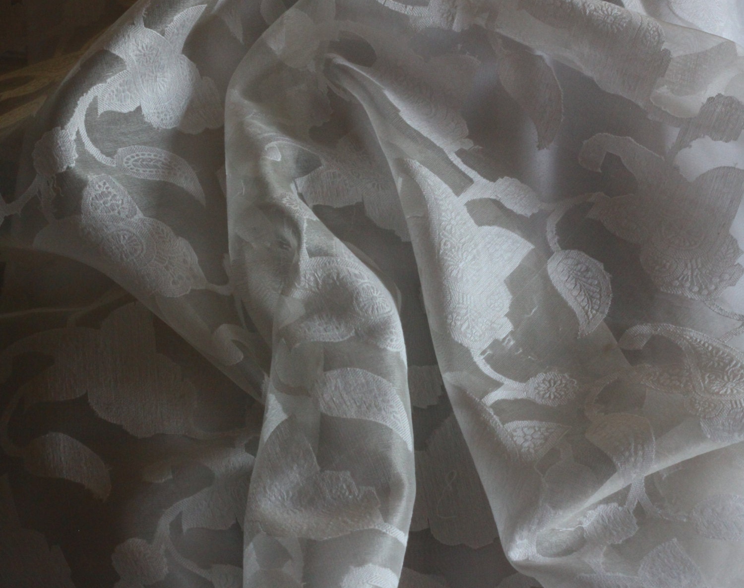 Different fabrics. Organza, chiffon, silk, jacquard are spread out