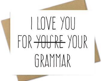May include: A white greeting card with the text "I LOVE YOU FOR YOUR GRAMMAR" in black, with "YOU'RE" crossed out. The card is inside a brown envelope.