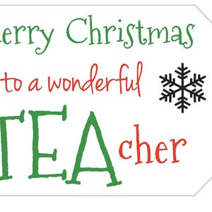 May include: White gift tag with the message "Merry Christmas to a wonderful TEACHER" in green and red. A black snowflake graphic is to the right of the text. The tag has a hole for attaching to a gift.