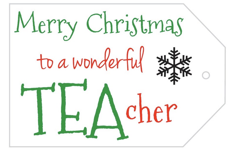 May include: White gift tag with the message "Merry Christmas to a wonderful TEACHER" in green and red. A black snowflake graphic is to the right of the text. The tag has a hole for attaching to a gift.