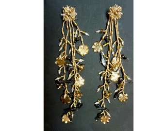 Seven inch elegant gold, black stone birds and opalescent beads in post back earrings.