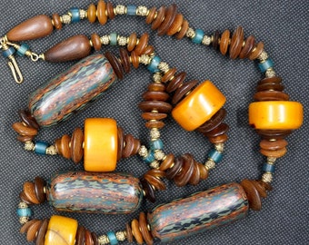 Necklace of Vintage Yoruba gold wash granulated beads, glass, copal and golden horn beads from the Phillippines.  36 inches,