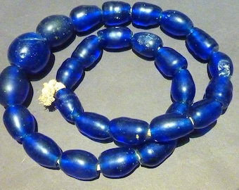 Old Bohemian wound blue glass graduated Trade Beads, 17x22 to 30x30 mm. (2 beads damaged, shown in photo)