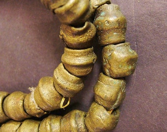 BT1038 African trade lost wax very old bicone brass beads, 20 inches, 55 beads from 10 mm to 14 mm