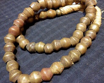 BT875 African trade lost wax very very old bicone brass beads, 21 inches, 49 beads from 10 mm to 14 mm
