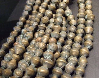 African trade, Vintage Ethiopian lost wax cast brass bicone beads, 20 inches, average bicone is 10 mm. (Brass 47)