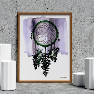 May include: A framed watercolor print of a purple and green dreamcatcher with a white background. The dreamcatcher is hanging from a green branch with a white background. The print is framed in a brown wood frame.