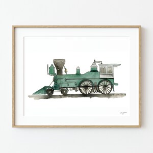 May include: Watercolor painting of a vintage green steam train in a wooden frame. The train features a black smokestack, large wheels, and a small white cabin. The artwork is on a white background.