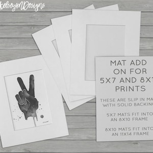 May include: Four white mat boards with cutouts for 5x7 and 8x10 prints. The text on the mat board reads "MAT ADD ON FOR 5X7 AND 8X10 PRINTS THESE ARE SLIP IN MATS WITH SOLID BACKING. 5X7 MATS FIT INTO AN 8X10 FRAME 8X10 MATS FIT INTO AN 11X14 FRAME"