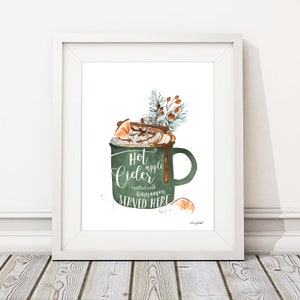 May include: A watercolor illustration of a green mug with a white rim and handle. The mug is filled with a brown liquid topped with whipped cream, caramel sauce, and a cinnamon stick. The text "Hot apple cider mulled with cinnamon SERVED HERE" is written on the mug.