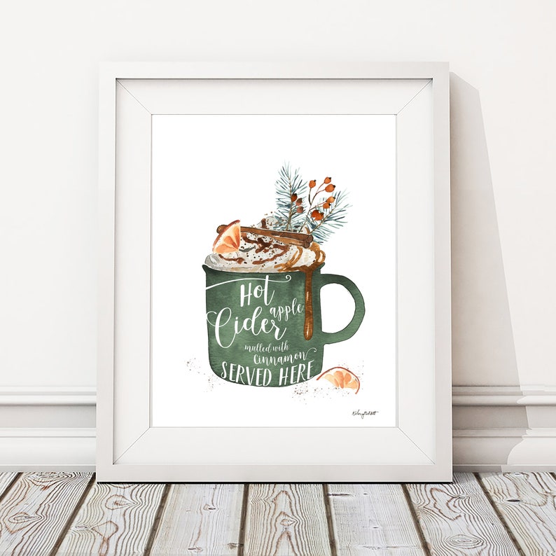 May include: A watercolor illustration of a green mug with a white rim and handle. The mug is filled with a brown liquid topped with whipped cream, caramel sauce, and a cinnamon stick. The text "Hot apple cider mulled with cinnamon SERVED HERE" is written on the mug.