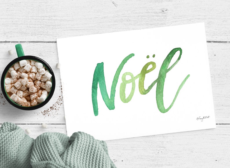 May include: A watercolor painting of the word "No&euml;l" in green and yellow hues on a white background. The word is written in a cursive script.