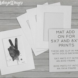 May include: Four white mat boards with cutouts for 5x7 and 8x10 prints. The text on the mat board reads "MAT ADD ON FOR 5X7 AND 8X10 PRINTS THESE ARE SLIP IN MATS WITH SOLID BACKING. 5X7 MATS FIT INTO AN 8X10 FRAME 8X10 MATS FIT INTO AN 11X14 FRAME"
