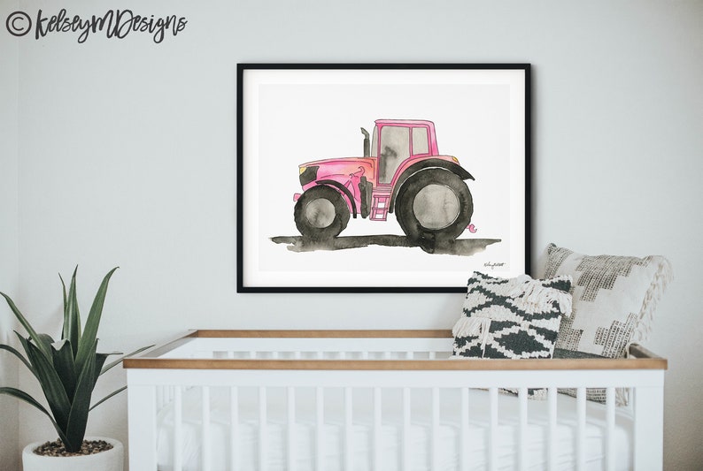 May include: A watercolor painting of a pink tractor on a white background. The tractor has black wheels and a black exhaust pipe. The painting is framed in a black frame.