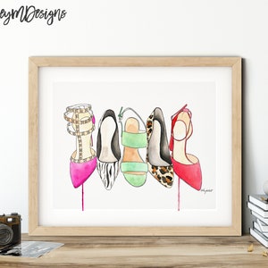 May include: A watercolor painting of five different high-heeled shoes. The shoes are in various colors and patterns, including pink, black and white zebra print, green, leopard print, and red. The shoes are arranged in a row, with the heels facing the viewer.