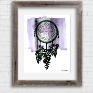 May include: A watercolor painting of a dreamcatcher with green and white details hanging over a forest of trees. The background is a soft purple watercolor wash. The artist's signature is in the bottom right corner.
