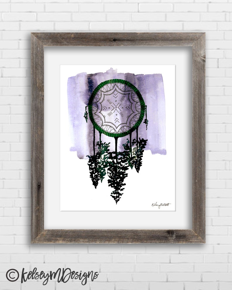 May include: A watercolor painting of a dreamcatcher with green and white details hanging over a forest of trees. The background is a soft purple watercolor wash. The artist's signature is in the bottom right corner.